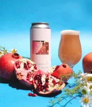 Pale pink beer behind pomegranates